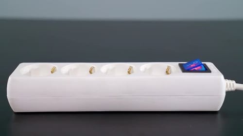 Inserting Black Plug into White Extension Cord