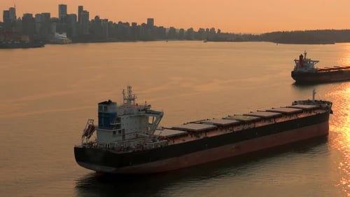 Aerial View of Cargo Bulkers Near the Port of Vancouver at Sunset