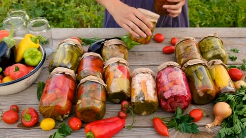 Preservation of Vegetables in Jars Woman Selective Focus