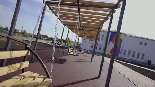 Swinging Benches Adorn Playground Area in Primary School Grounds