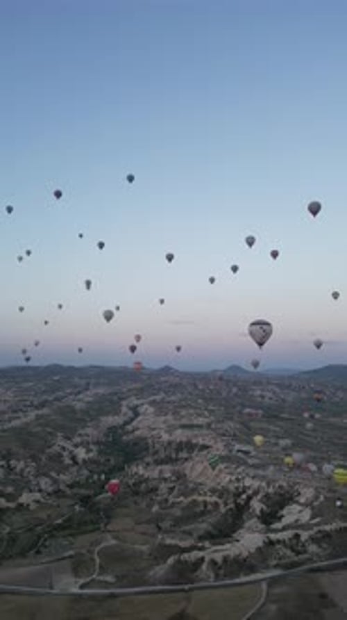 Aerial video over monoliths in Cappadocia, on hot air balloons, Turkey