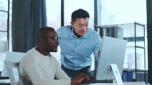 Two Businessmen Celebrate Success in Office