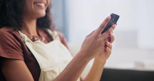 Woman, hands and search with phone on sofa for text message, social media post
