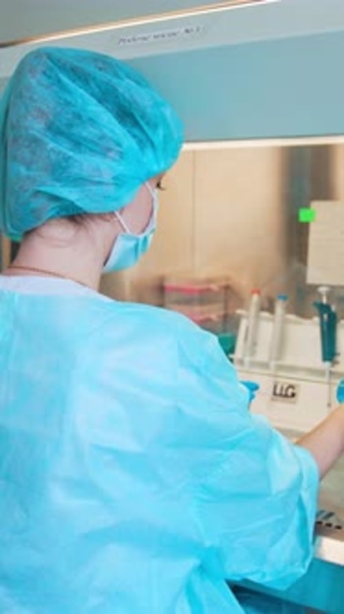 Woman Working in Clean Room Lab Environment