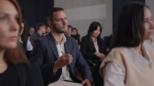 Engaging business conference speech at modern convention hall with diverse audience