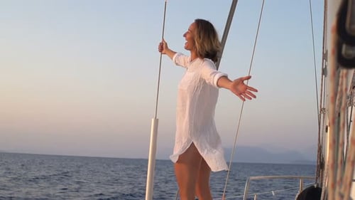 Young, Happy Woman Enjoying Sailing Boat on Sea Adult