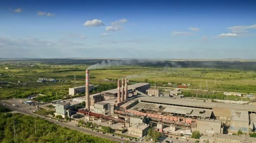 Approaching Factory Chimneys Contributing to Air Pollution and Harming the Atmosphere