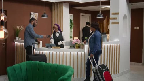 Guests Checking in at Hotel Reception