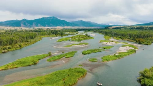 Beautiful River Valley Surrounded By Mountain Peaks Drone View