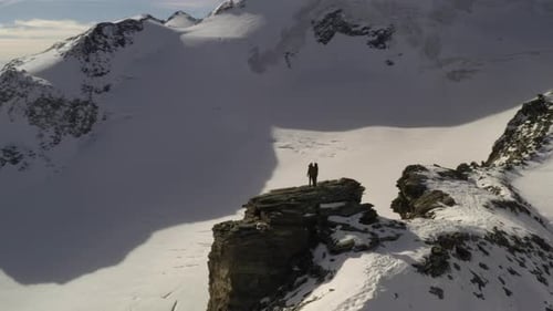 People enjoying the snow view in the mountains
