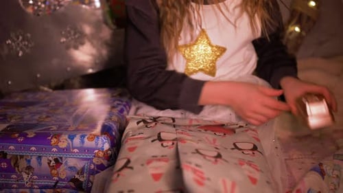 Young Girl Wraps Gifts for the Holidays