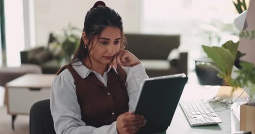 Business, tablet and woman in office, thinking and copywriting with research for article