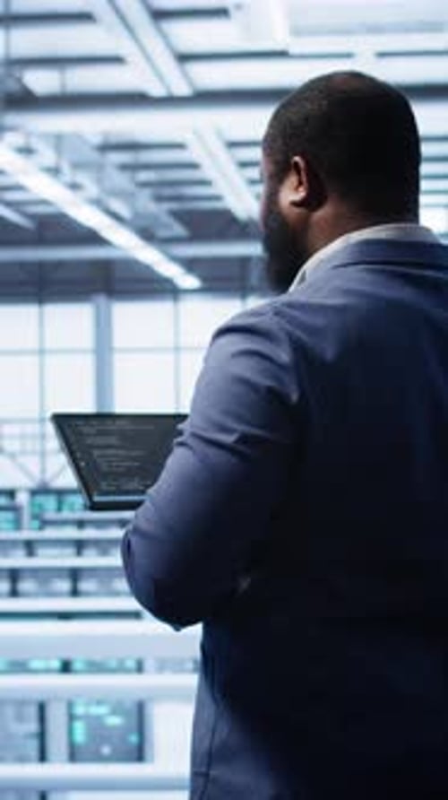 Vertical Video Engineer in Data Center Fixing Errors Affecting Server Rows Rigs