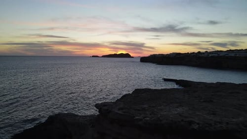 aerial shot of an incredible sunset in the background on the island of Ibiza