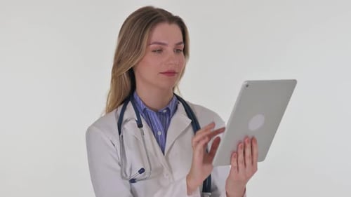 Woman doctor using tablet in clinical setting