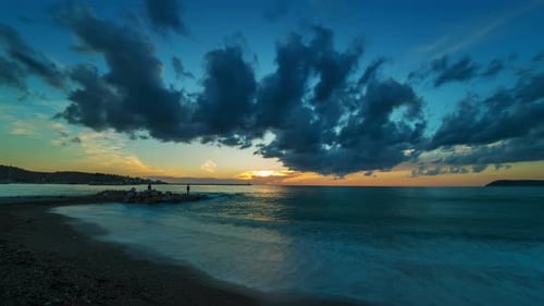 Sunset with Clouds Over Sea and Beach