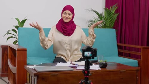 Youtuber Muslim Woman in Hijab Scarf Sitting on Couch