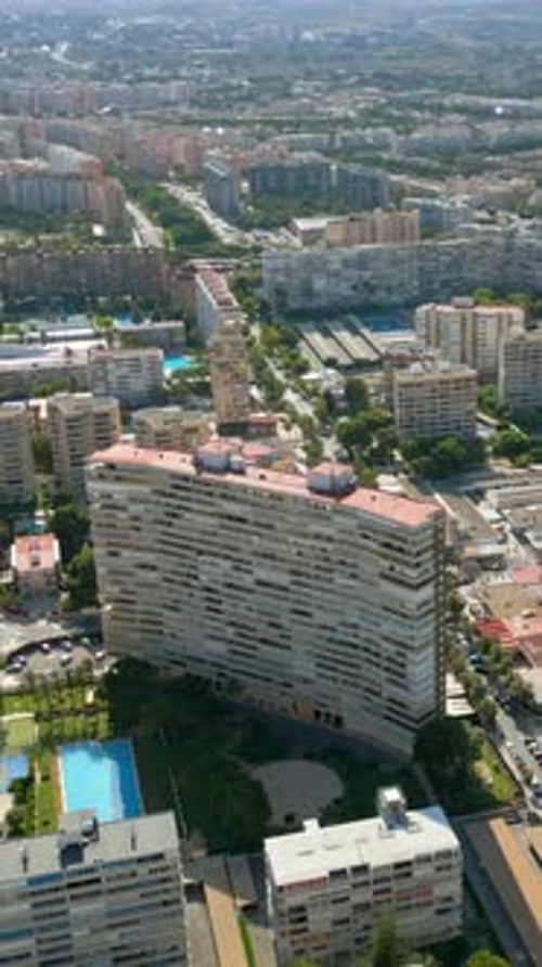 Aerial drone view of the buildings in Benidorm, Spain in daylight. Vertical