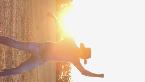 Happy Farmer Dancing in the Field at Sunset Harvesting Wheat Rural Business Vertical Video