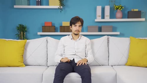 Man looking negative at camera.