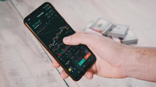 Crypto Trading in Smartphone Bitcoin Graph of Price on Stock Exchange