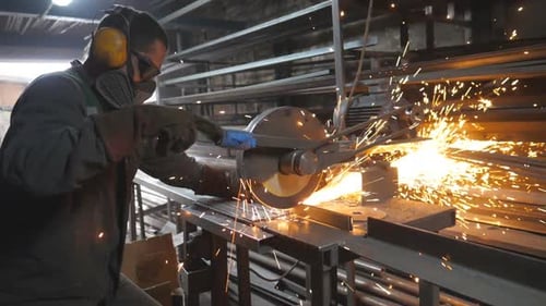 Man Use Saw Cutting Machine to Cut Metal Unrecognizable Guy with Circular Saw Sawing Steel in Garage