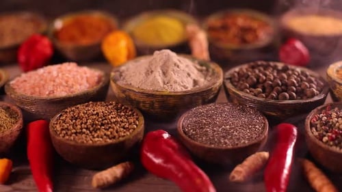Aromatic Spices and Herbs in Wooden Bowls