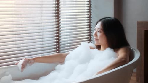 Woman Relaxing in Bubble Bath
