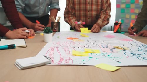 Collaborative Team Meeting with Colorful Sticky Notes in Modern Office Space for