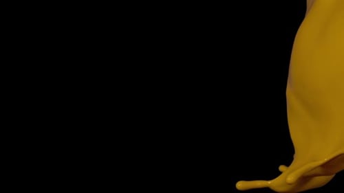 Super Slow Motion Shot of Yellow Ink Splash