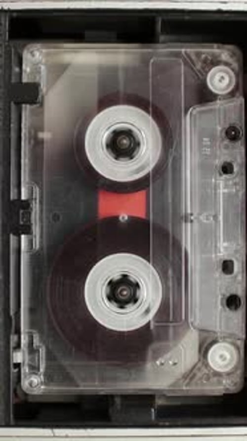Audio Cassette Tape Spinning in Vintage Player
