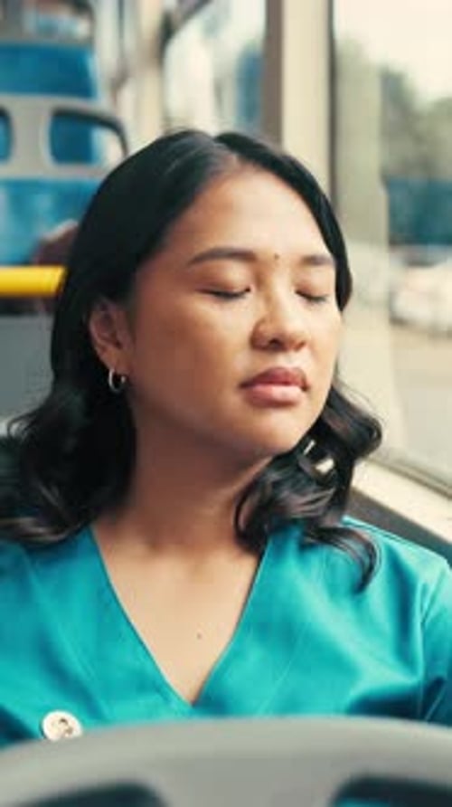 Tired, commute or nurse on bus with sleep, exhausted and burnout with afternoon travel