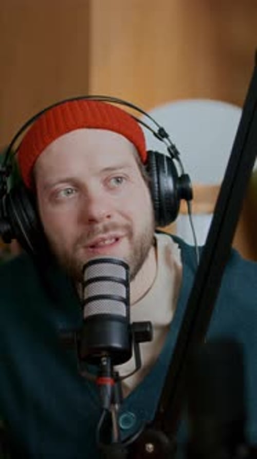 Young Man Talking in Studio Mic as Recording Podcast Episode or Interview