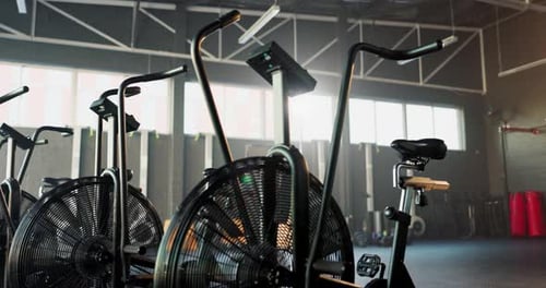 Elliptical, gym and bike for cardio, fitness and exercise for health and wellness