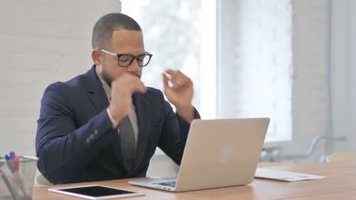 Adult Man Working on Laptop in Office