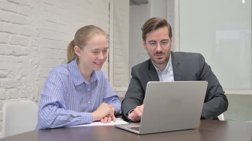 Positive Business People Working on Laptop in Office