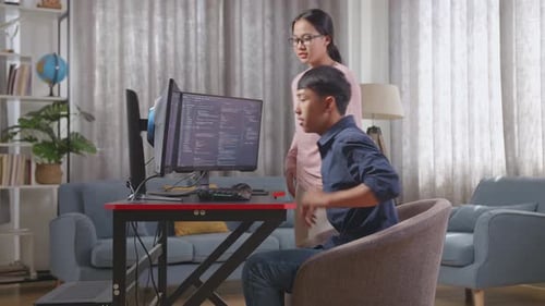 Asian Boy Teaching His Sister Creating Software Engineer Developing App, Program