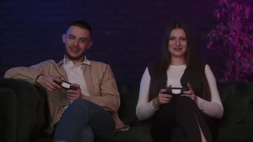 Young Couple Playing Video Games at Home