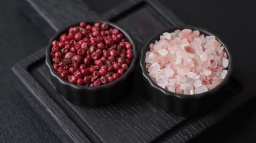 Bowls of Pink Salt and Red Peppercorns