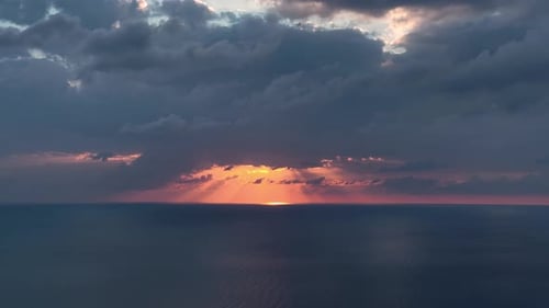 Beautiful Sunset Over Sea with Cloudy Orange Sky