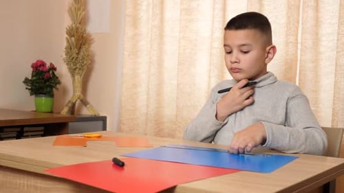 Boy Drawing Lines for Paper Craft Project