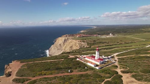 Aerial View of Coastal Lighthouse on Rocky Cliffs