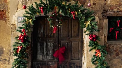 Festive Christmas Decorations Adorn Weathered Doorway