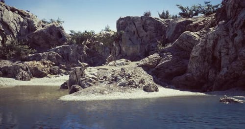 Rocky Landscape Surrounding Calm Water in a Serene Natural Setting