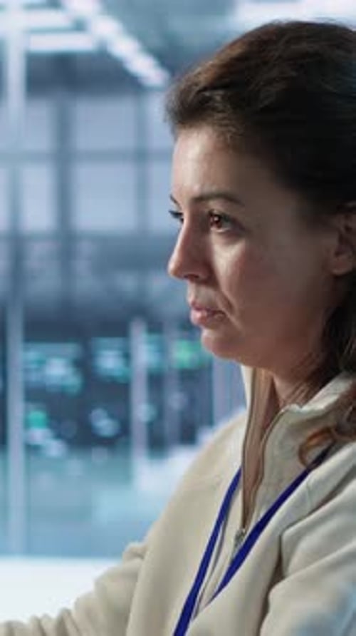 Woman Smiles in Data Center Server Room