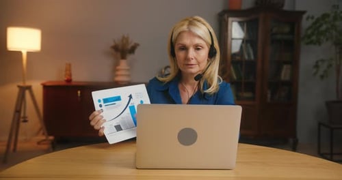 Professional Woman Presenting Data via Video Call