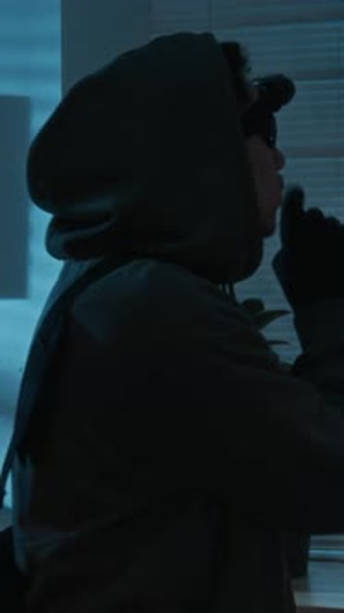 Man Wearing Balaclava Indoors in the Dark