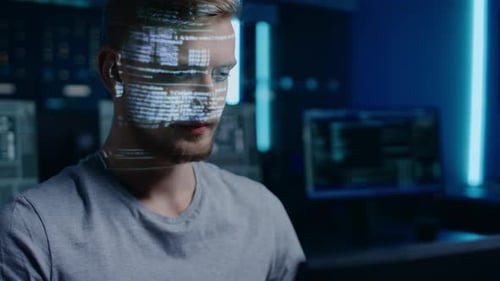 Hacker Working in a Dark Room