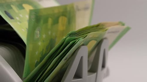 Counting Green Euro Banknotes With Money Counting Machine