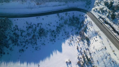 Road Winds Through Snowy Winter Landscape